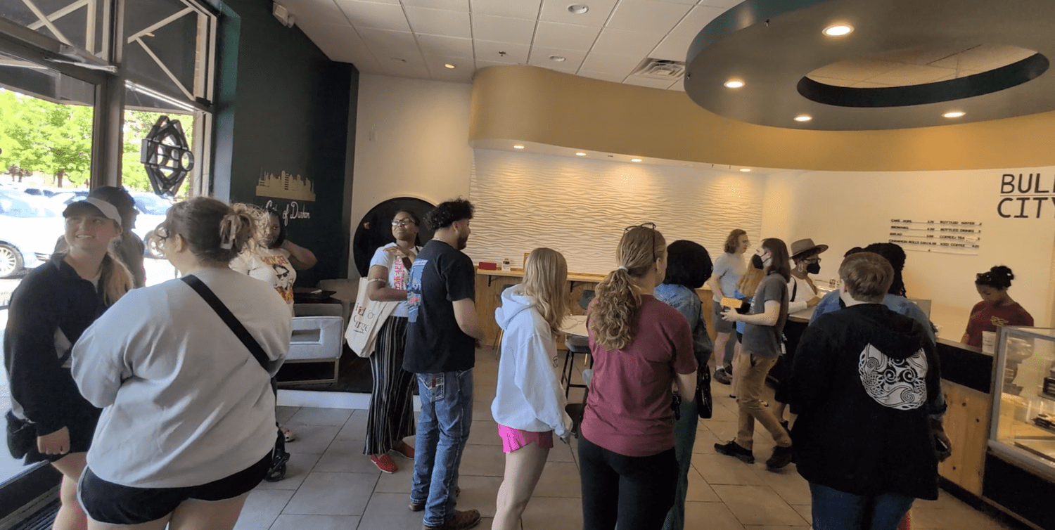 Locals gathering inside Bull City Bake Shop for a Discovery Drop