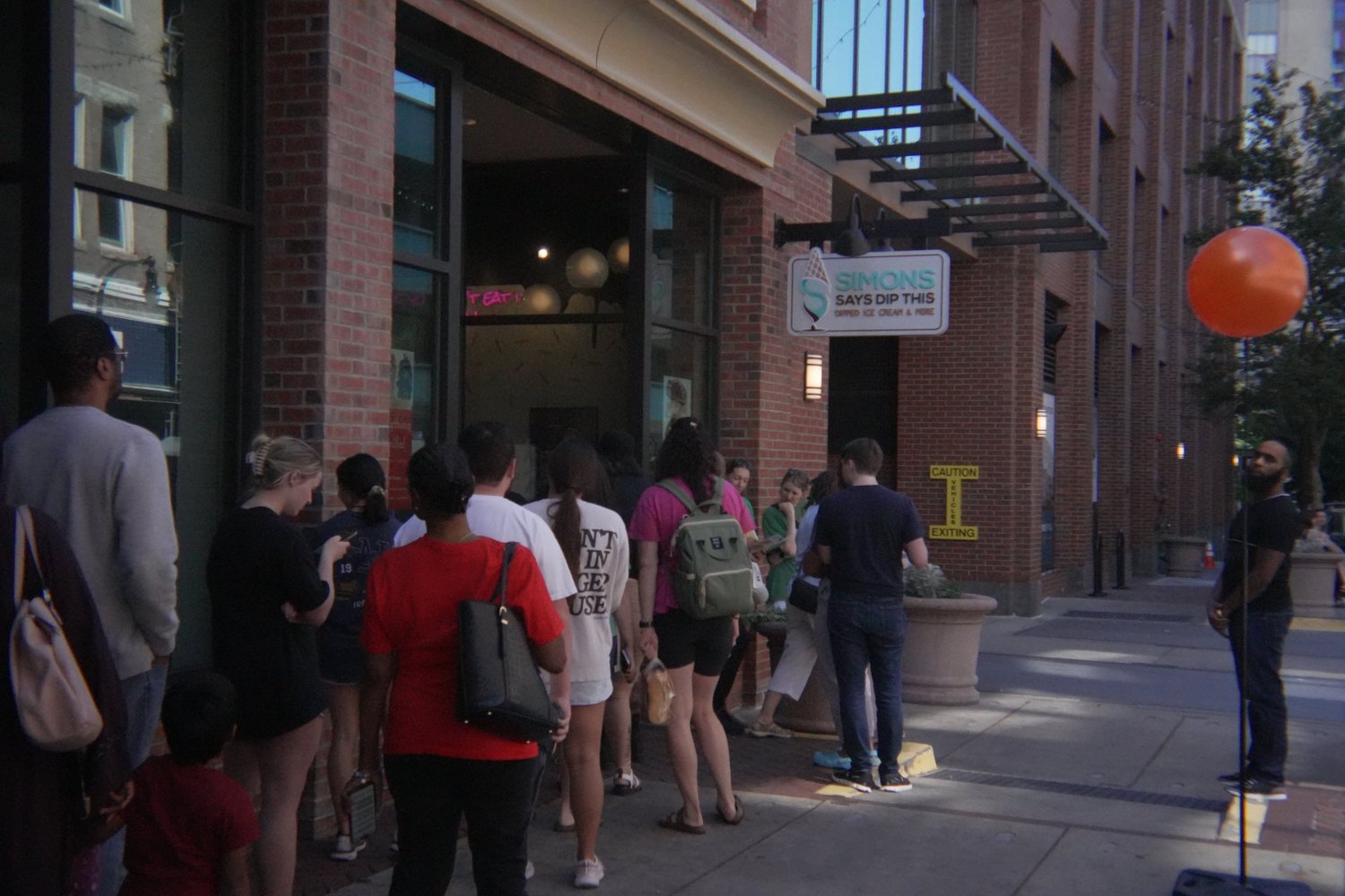 Discovery Drop guests outside Simons Says Dip This in downtown Durham